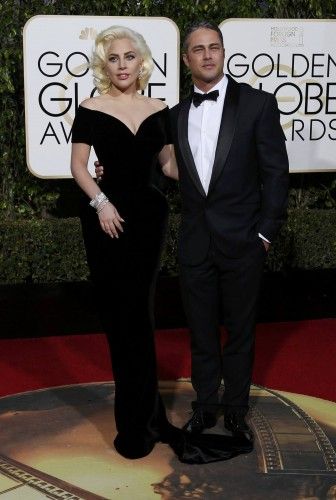 Singer Lady Gaga arrives with fiance Taylor Kinney at the 73rd Golden Globe Awards in Beverly Hills