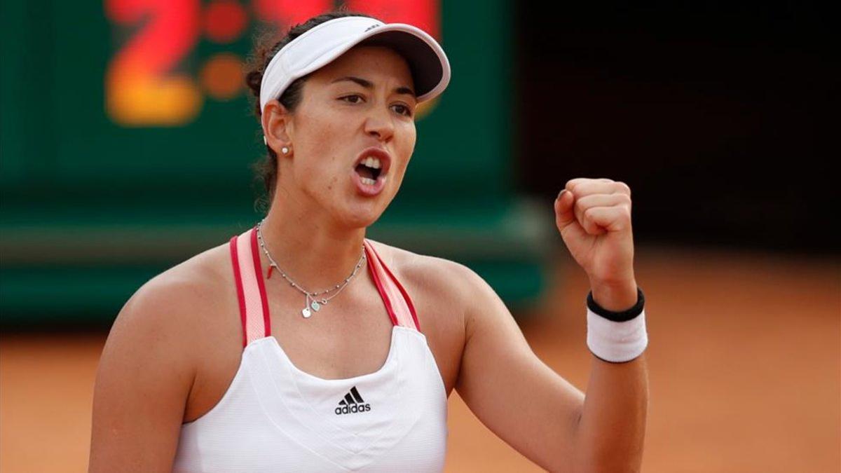 Muguruza celebra su triunfo ante Azarenka