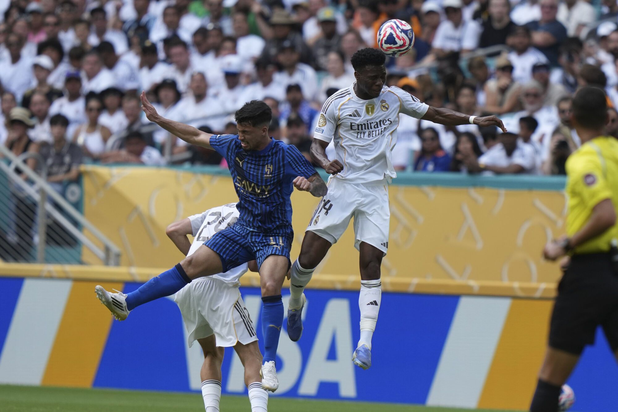 Al-Hilal's Marcos Leonardo, left, and Real Madrid's Aurelien Tchouameni jump for the ball during the Club World Cup group H soccer match between Real Madrid and Al Hilal in Miami, Fla., Wednesday, June 18, 2025. (AP Photo/Lynne Sladky). EDITORIAL USE ONLY/ONLY ITALY AND SPAIN