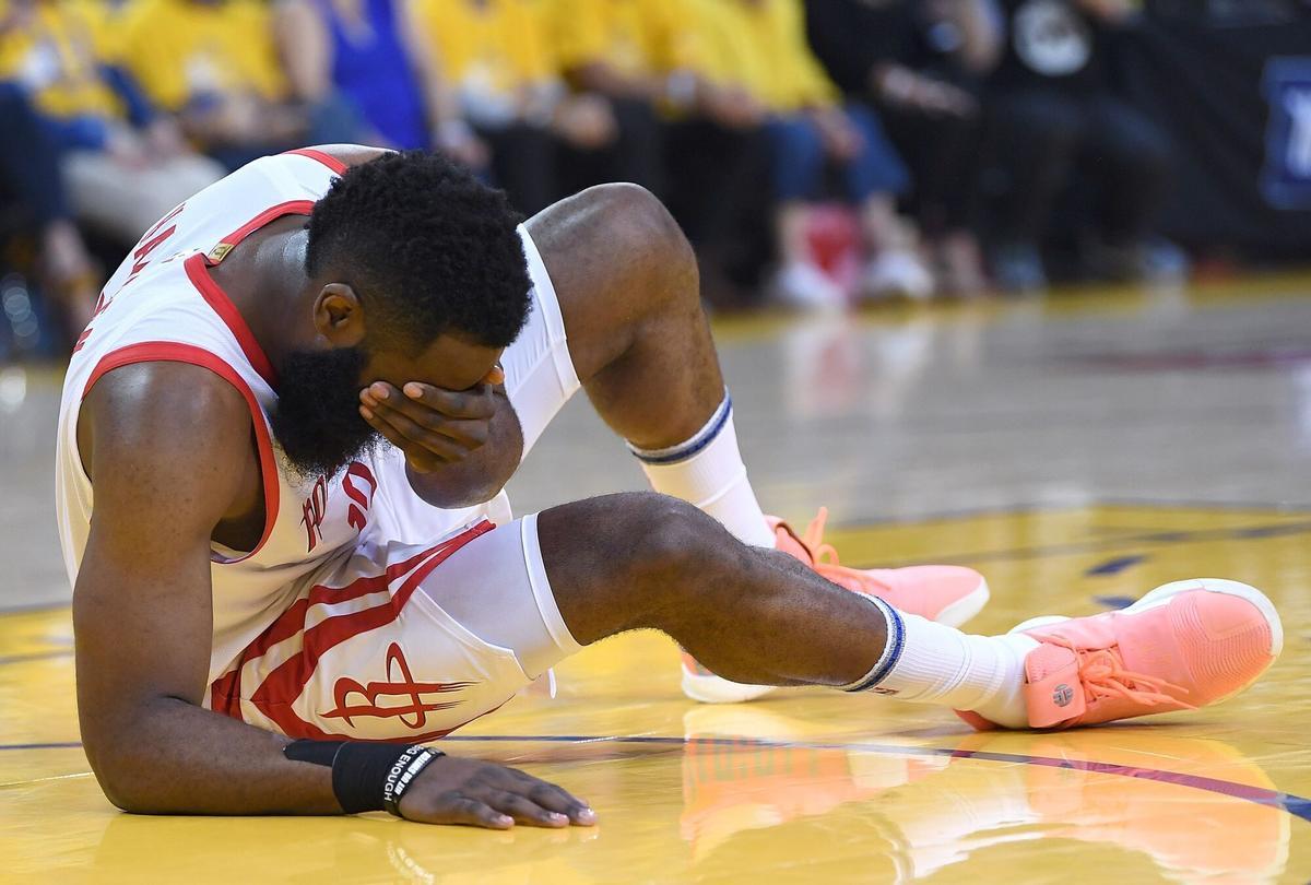 OAKLAND, CA - APRIL 30: James Harden #13 of the Houston Rockets falls to the floor grabbing his face after being accidentlly poked in the eye by Draymond Green of the Golden State Warriors in Game Two of the Second Round of the 2019 NBA Western Conference Playoffs at ORACLE Arena on April 30, 2019 in Oakland, California. NOTE TO USER: User expressly acknowledges and agrees that, by downloading and or using this photograph, User is consenting to the terms and conditions of the Getty Images License Agreement. Thearon W. Henderson/Getty Images/AFP== FOR NEWSPAPERS, INTERNET, TELCOS &amp; TELEVISION USE ONLY ==. HORIZONTAL