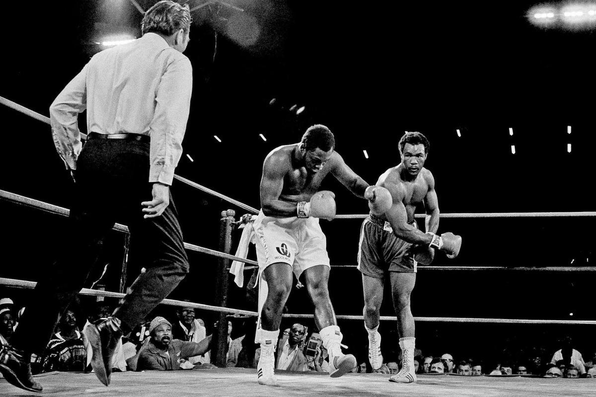FILE - Joe Frazier is staggered by hard right in second round of heavyweight title fight by challenger George Foreman in Kingston, Jamaica, on Jan. 23, 1973. (AP Photo, File). EDITORIAL USE ONLY/ONLY ITALY AND SPAIN