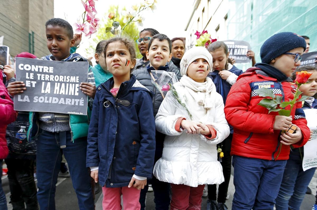 Children take part in a rally called The march against the fear, Tous Ensemble, Samen Een, All Together in memory of the victims of bomb attacks in Brussels metro and Brussels international airport of Zaventem in Brussels, Belgium, April 17, 2016. REUTERS/Yves Herman
