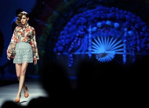 A model presents an outfit created by designer Francis Montesinos during the Mercedes-Benz Fashion Week in Madrid