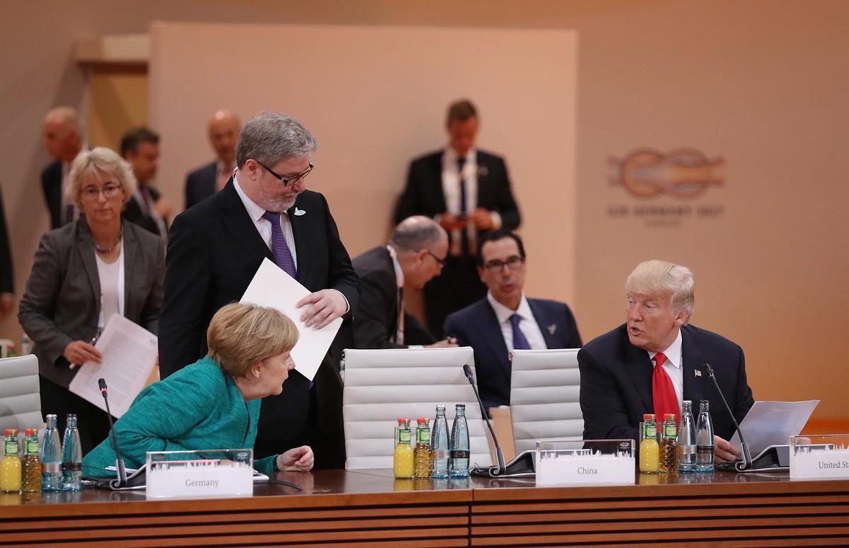 775004210  Hamburg  Germany   08 07 2017 - German Chancellor Angela Merkel  L  and US President Donald Trump attend the morning working session on the second day of the G20 economic summit in Hamburg  Germany 08 July 2017  The G20 Summit  or G-20 or Group of Twenty  is an international forum for governments from 20 major economies  The summit is taking place in Hamburg 07 to 08 July 2017   Hamburgo  Alemania  EFE EPA SEAN GALLUP   POOL