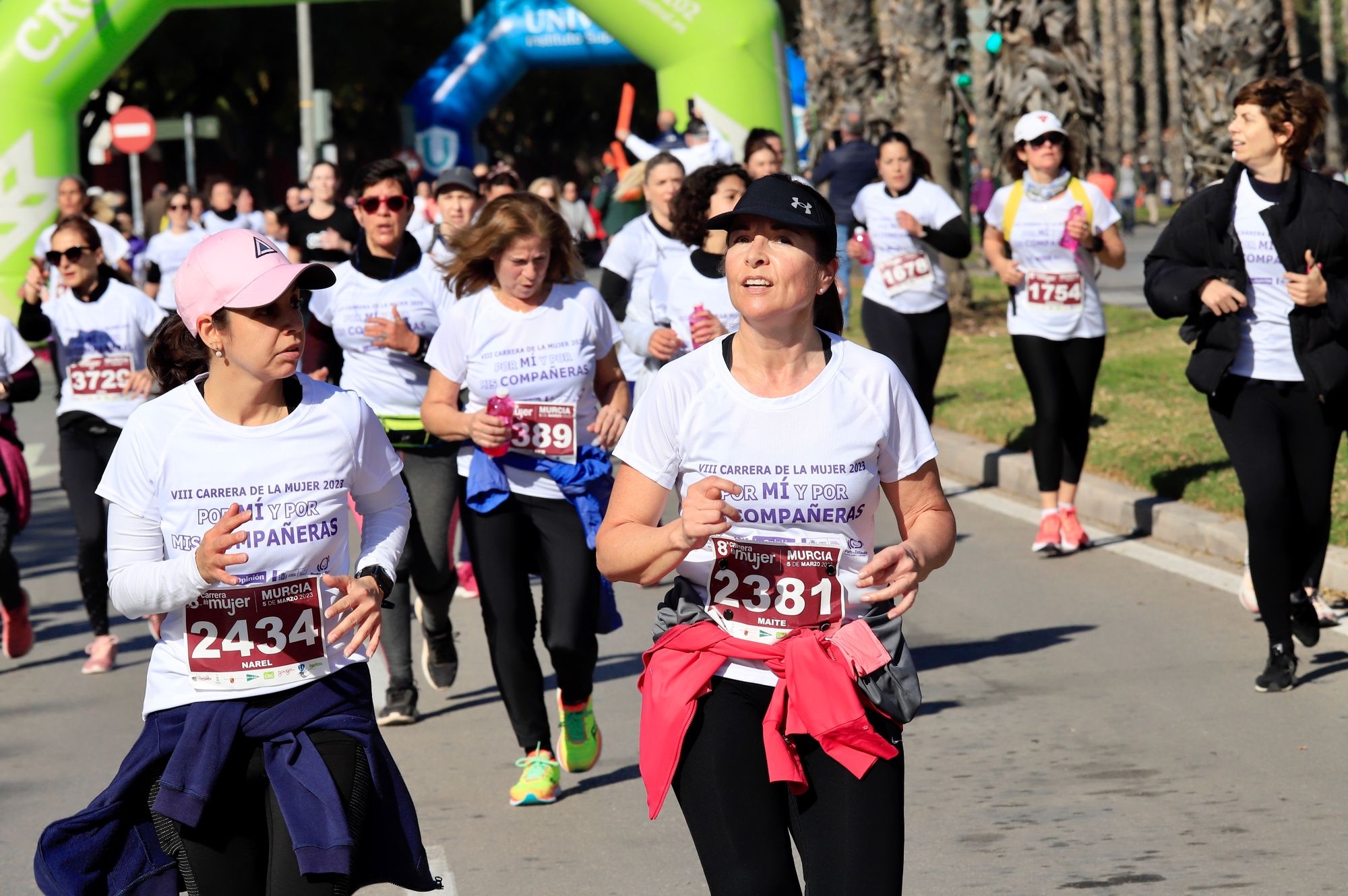 La salida y el recorrido de la Carrera de la Mujer 'inmortalizados' en imágenes