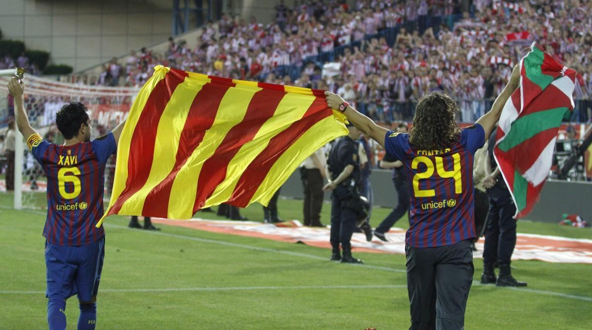 Xavi y Puyol celebran la Copa conseguida en 2012 frente al Athletic Club
