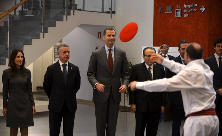 A Basque dancer throws his beret to Spain's King Felipe during the opening of the National Congress of Family Businesses at the Palacio Euskaldun in Bilbao