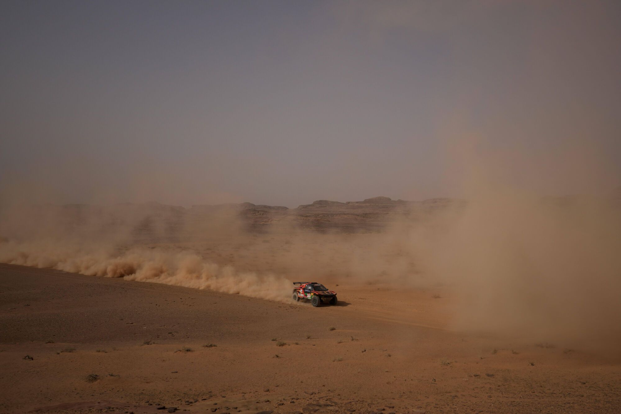 Driver Yongming Tao and co-driver Liguo Fu compete during the third stage of the Dakar Rally with a start and finish in Alula, Saudi Arabia, Tuesday, Jan. 6, 2026. (AP Photo/Thibault Camus)