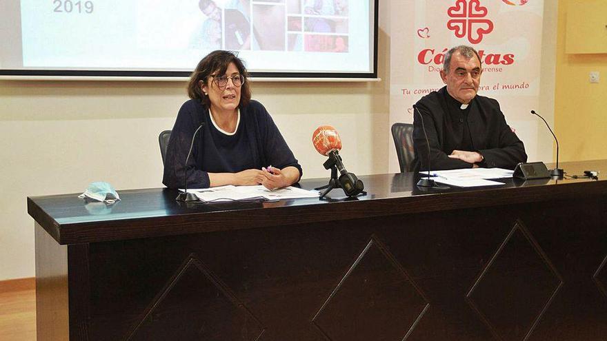 María Tabarés y J. Ángel Feijóo, ayer, durante la presentación de la memoria 2019 de Cáritas.