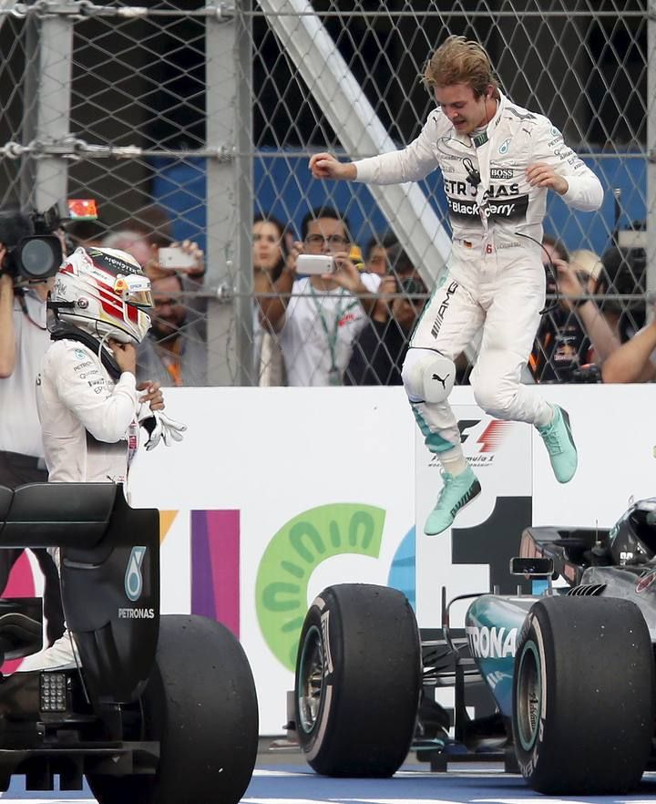 Mercedes Formula One driver Nico Rosberg of Germany celebrates next to his teammate Lewis Hamilton of Britain after winning the Mexican F1 Grand Prix at Autodromo Hermanos Rodriguez in Mexico City