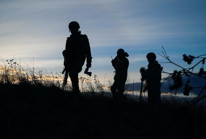 Ukrainian servicemen take positions at the military airbase Vasylkiv in the Kyiv region