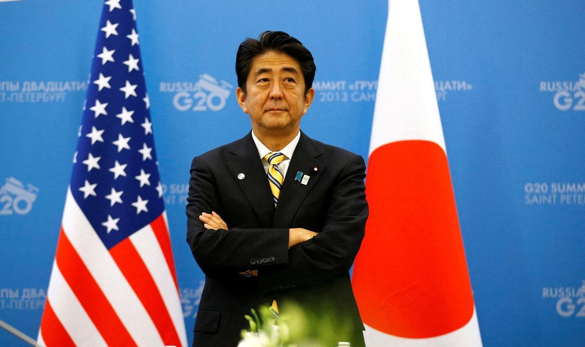 FILE PHOTO: Japanese PM Abe waits for U.S. President Obama to arrive for their meeting at the G20 Summit in St. Petersburg
