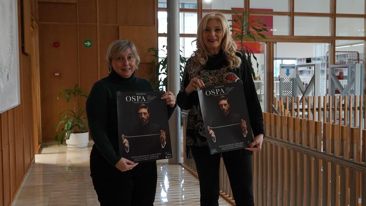 Isabel González (izquierda) y Aurora Cienfuegos, con los carteles del evento.