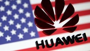 FILE PHOTO - A 3D printed Huawei logo is placed on glass above a displayed U S  flag in this illustration taken January 29  2019  REUTERS Dado Ruvic Illustration File Photo