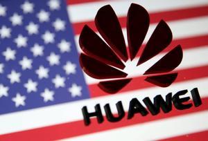 FILE PHOTO - A 3D printed Huawei logo is placed on glass above a displayed U S  flag in this illustration taken January 29  2019  REUTERS Dado Ruvic Illustration File Photo