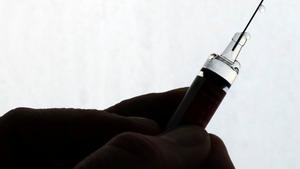 FILE PHOTO: A doctor prepares a syringe as part of the start of the seasonal influenza vaccination campaign in Nice, France October 24, 2017.   REUTERS/Eric Gaillard/File Photo