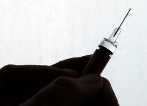 FILE PHOTO: A doctor prepares a syringe as part of the start of the seasonal influenza vaccination campaign in Nice, France October 24, 2017.   REUTERS/Eric Gaillard/File Photo