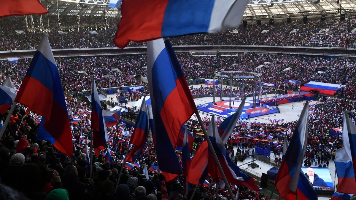 Russian President Vladimir Putin attends a concert marking the eighth anniversary of Russia's annexation of Crimea in Moscow