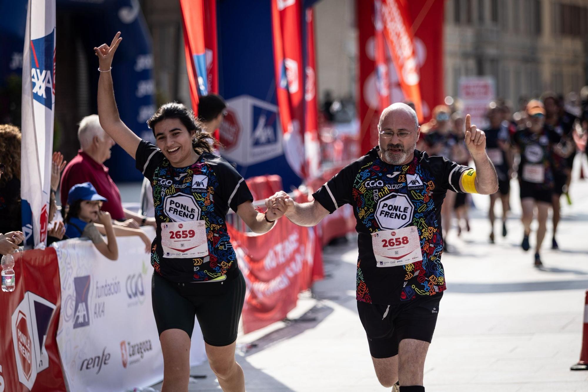 En imágenes | La carrera Ponle Freno sca a la calle a miles de personas en Zaragoza