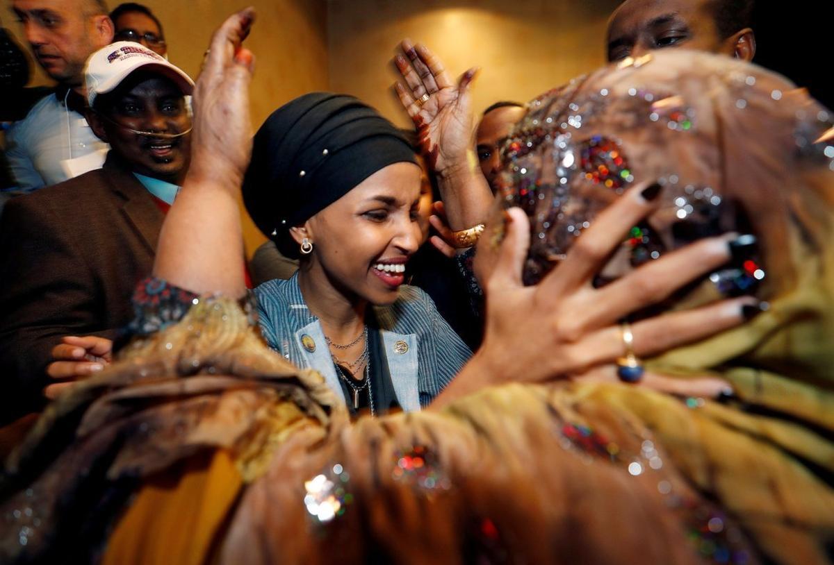 Democratic congressional candidate Ilhan Omar is greeted by her husbandâ¿¿s mother after appearing at her midterm election night party in Minneapolis, Minnesota, U.S. November 6, 2018. REUTERS/Eric Miller     TPX IMAGES OF THE DAY