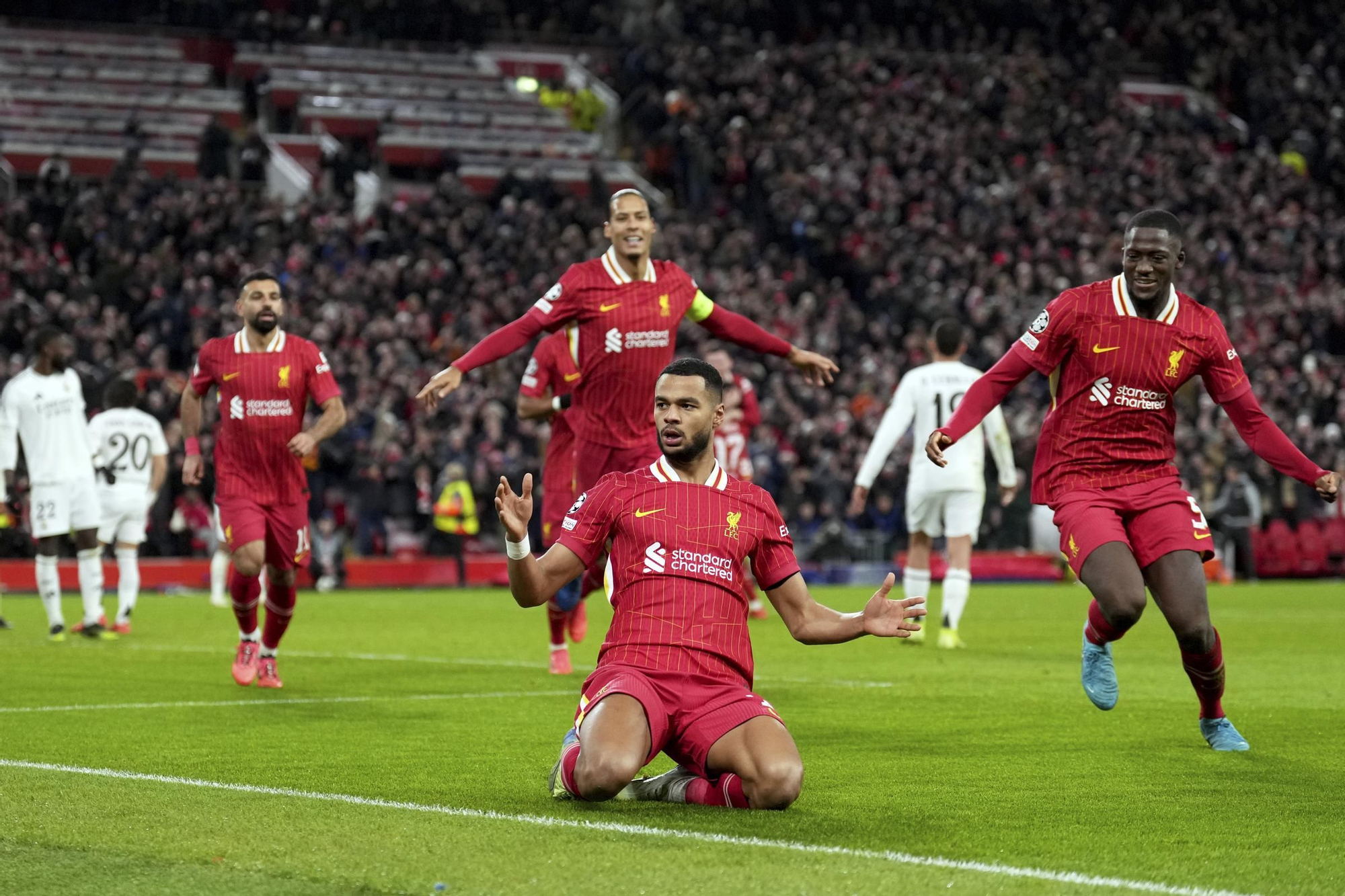 Liverpool's Cody Gakpo celebrates after scoring his side's second goal during the Champions League opening phase soccer match between Liverpool and Real Madrid at Anfield Stadium, Liverpool, England, Wednesday, Nov. 27, 2024. (AP Photo/Jon Super)