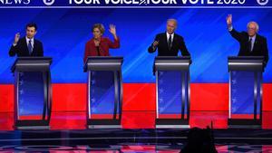 TOPSHOT - (From L) Democratic presidential hopefuls former Mayor of South Bend, Indiana, Pete Buttigieg, Massachusetts Senator Elizabeth Warren, former Vice President Joe Biden and Vermont Senator Bernie Sanders gesture during the eighth Democratic primary debate of the 2020 presidential campaign season co-hosted by ABC News, WMUR-TV and Apple News at St. Anselm College in Manchester, New Hampshire, on February 7, 2020. (Photo by Timothy A. CLARY / AFP)