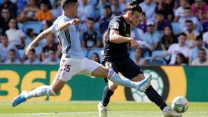 Soccer Football - La Liga Santander - Celta Vigo v Real Madrid - Balaidos  Vigo  Spain - August 17  2019  Real Madrid s Gareth Bale in action with Celta Vigo s Lucas Olaza   REUTERS Miguel Vidal
