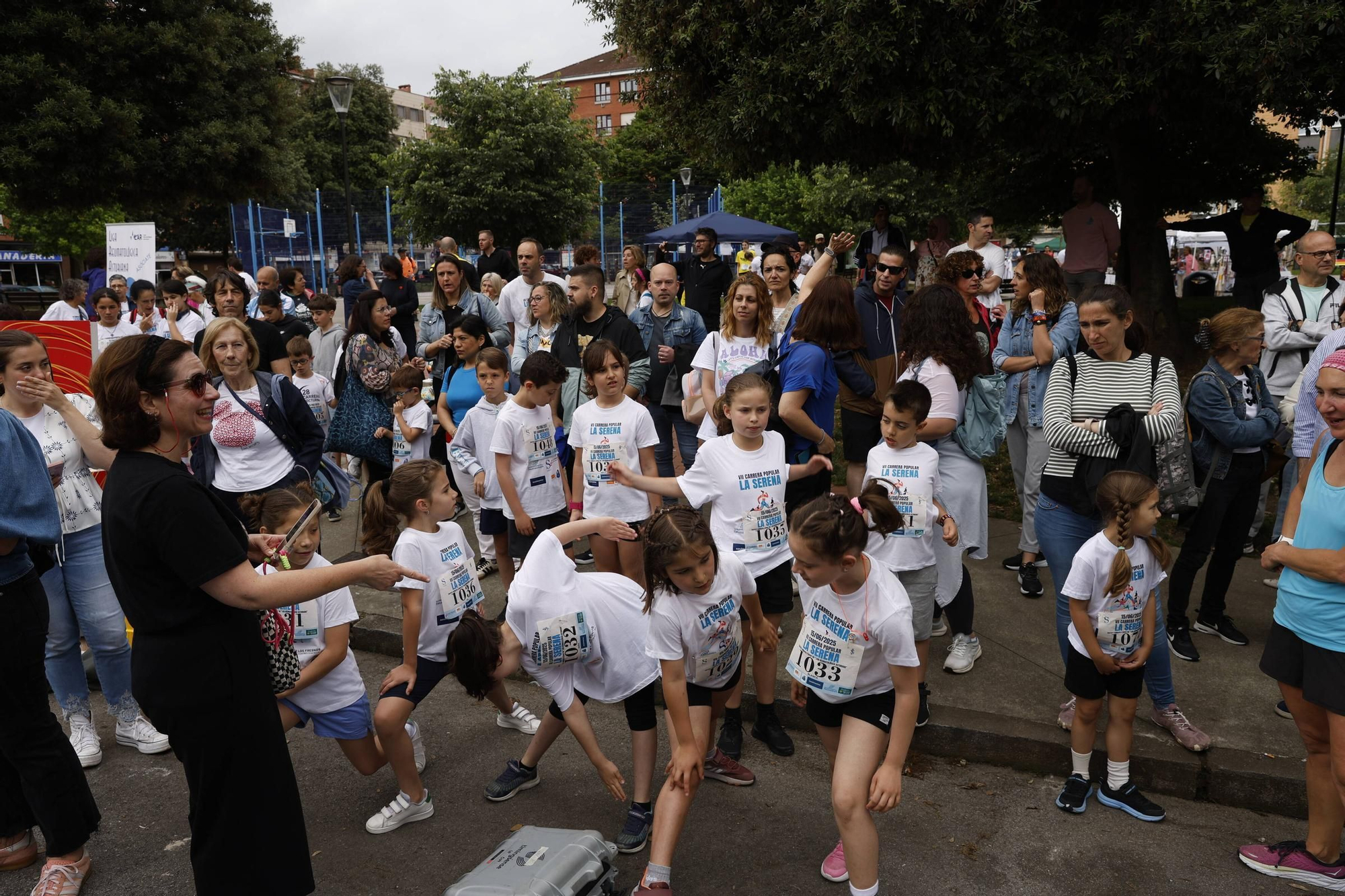 La carrera popular solidaria en El Llano, en Gijón, en imágenes