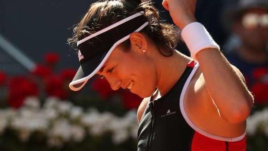 Muguruza celebra su victoria ante la china Peng.