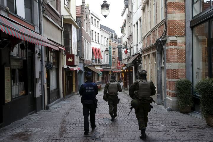 Belgian soldiers patrol a shopping street where tourists frequented in central Brussels, after security was tightened in Belgium following the fatal attacks in Paris