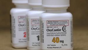FILE PHOTO: Bottles of prescription painkiller OxyContin pills, made by Purdue Pharma LP, are seen on a counter at a local pharmacy in Provo, Utah, U.S., April 25, 2017.    REUTERS/George Frey/File Photo - RC16C26EFFB0