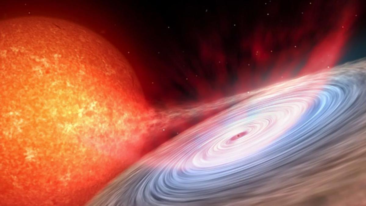 Impresión artística de eyecciones en forma de viento (gas rojizo) en torno a un agujero negro.