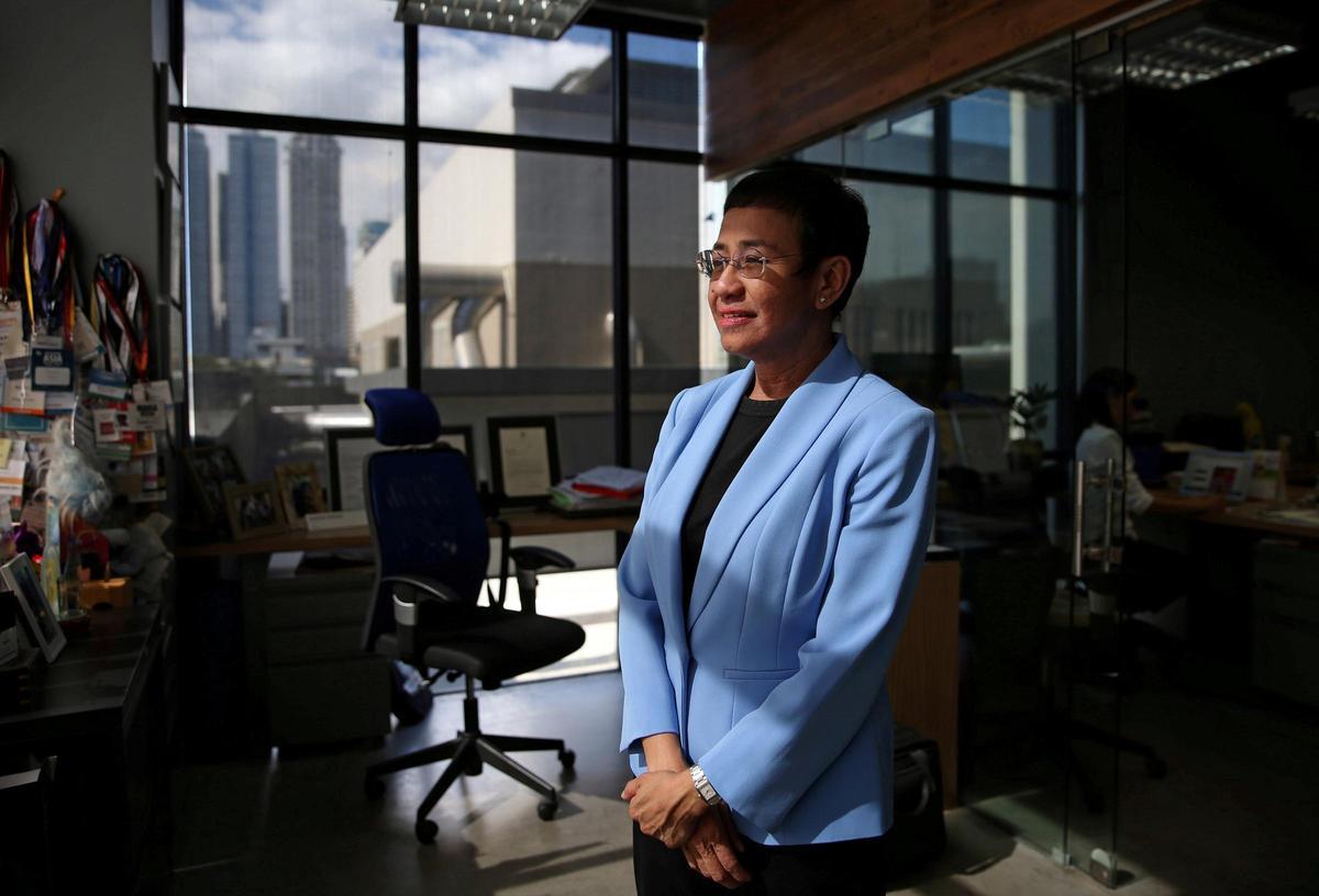 FILE PHOTO: Maria Ressa, an executive of online news platform Rappler, poses at Rappler's office in Pasig City, Metro Manila