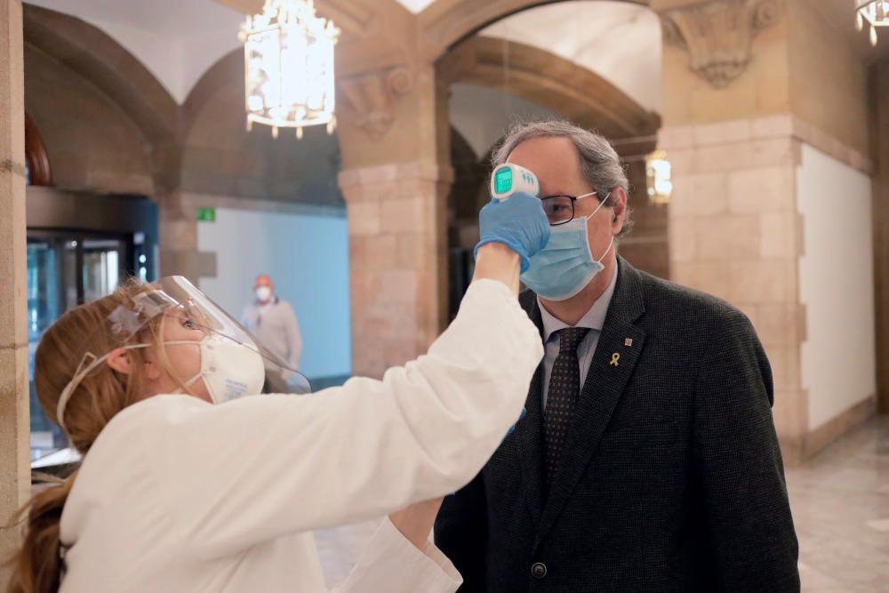 El primer ple del Parlament des del confinament, en fotos