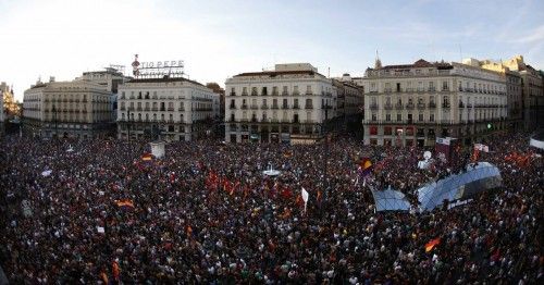 People take part in an anti-monarchist demonstration at Madrid's landmark Puerta del Sol Square