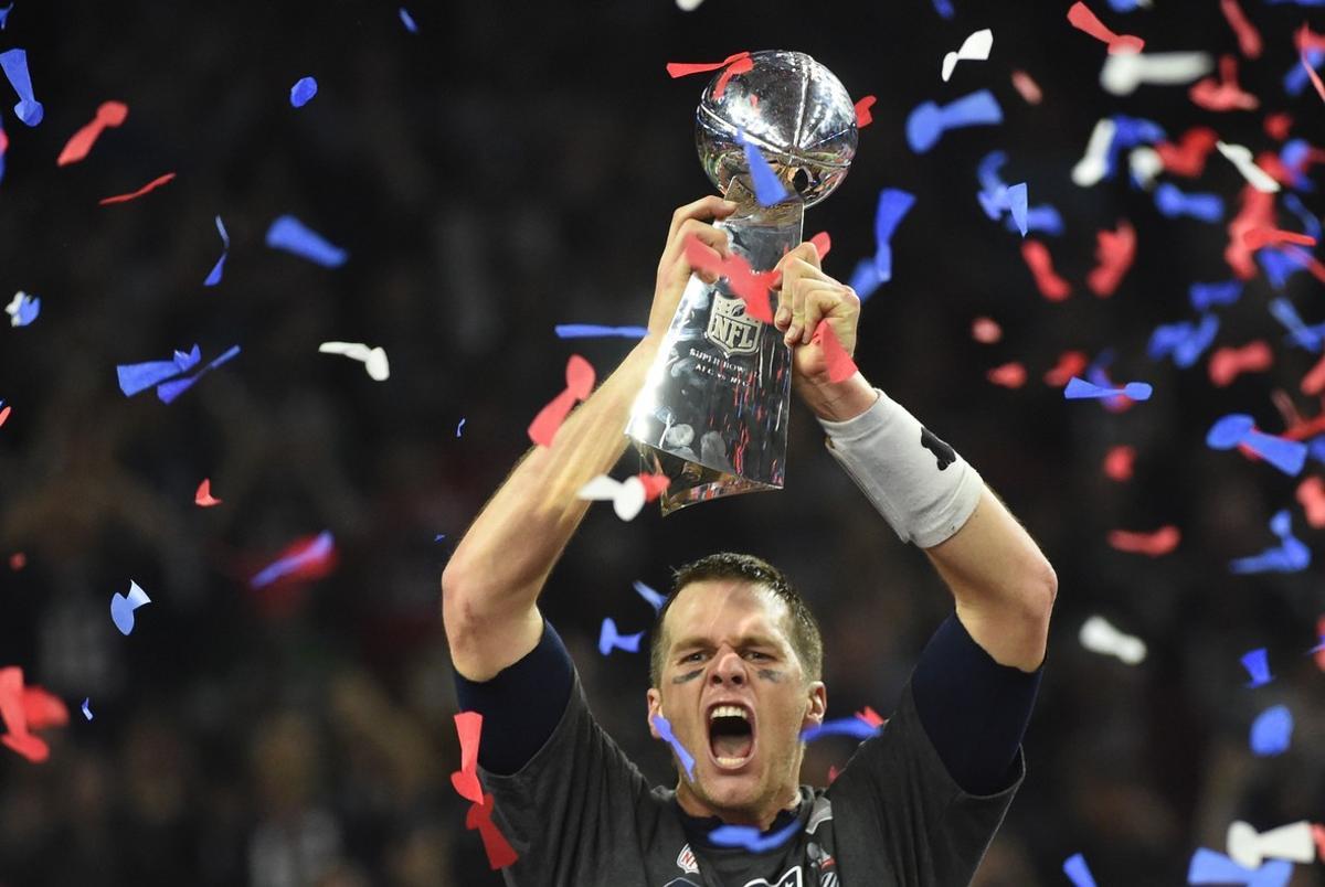 Tom Brady #12 of the New England Patriots holds the Vince Lombardi Trophy after defeating the Atlanta Falcons 34-28 in overtime during Super Bowl 51 at NRG Stadium on February 5, 2017 in Houston, Texas.