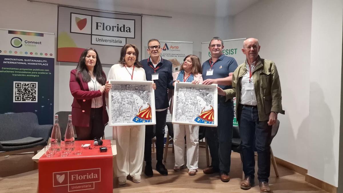 "El presidente de la Mancomunitat entrega la lámina de la DANA a las empresas socias de Resist."