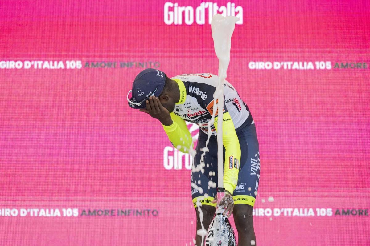 Jesi (Italy), 17/05/2022.- Eritrean rider Biniam Girmay of Team Intermarche-Wanty-Gobert Materiaux celebrates on the podium after winning the 10th stage of the Giro d’Italia 2022 cycling race, over 196km between Pescara and Jesi, central Italy, 17 May 2022. (Ciclismo, Italia) EFE/EPA/MAURIZIO BRAMBATTI