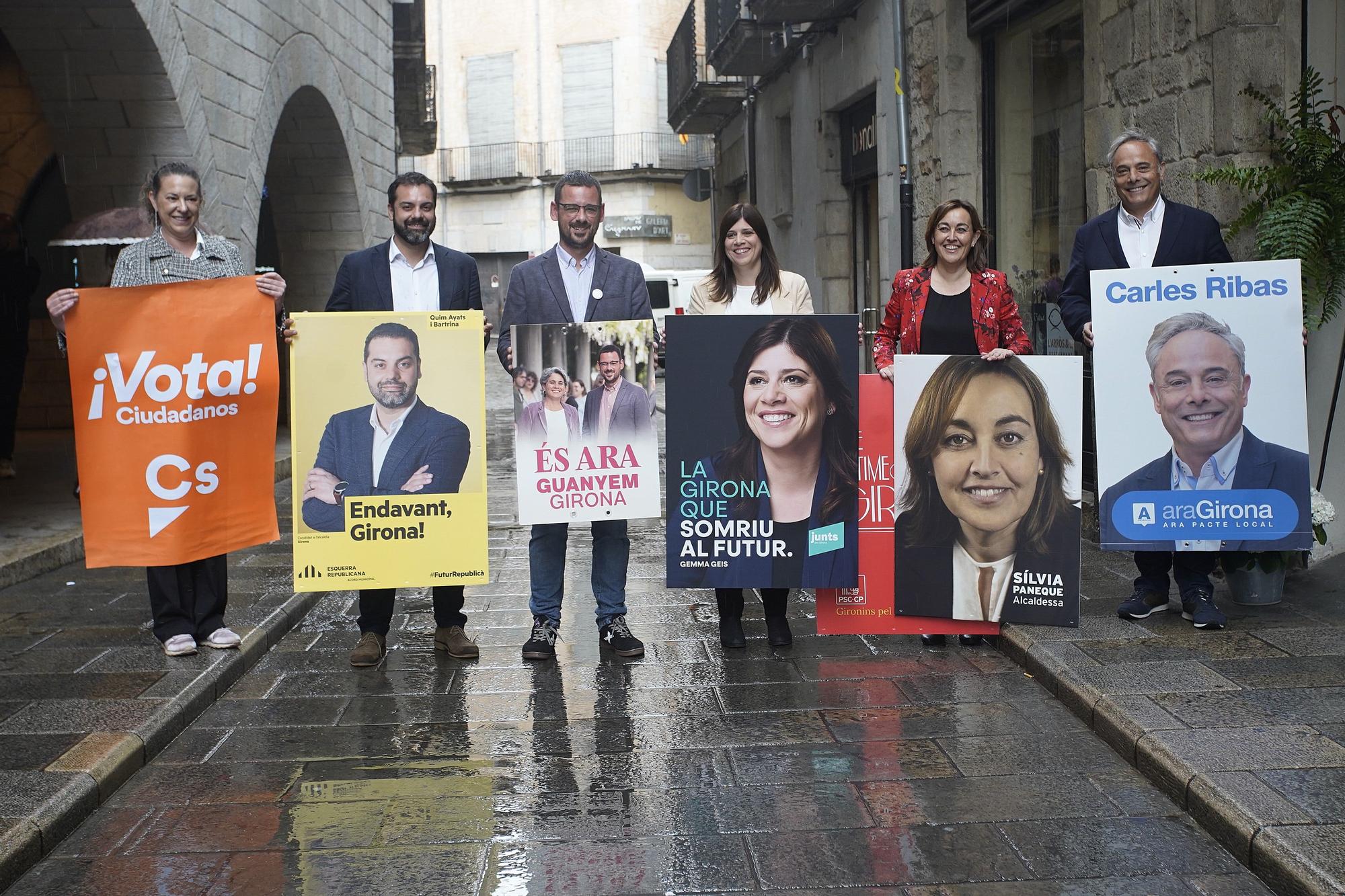 Els candidats a l&#039;alcaldia de Girona amb els respectius cartells electorals