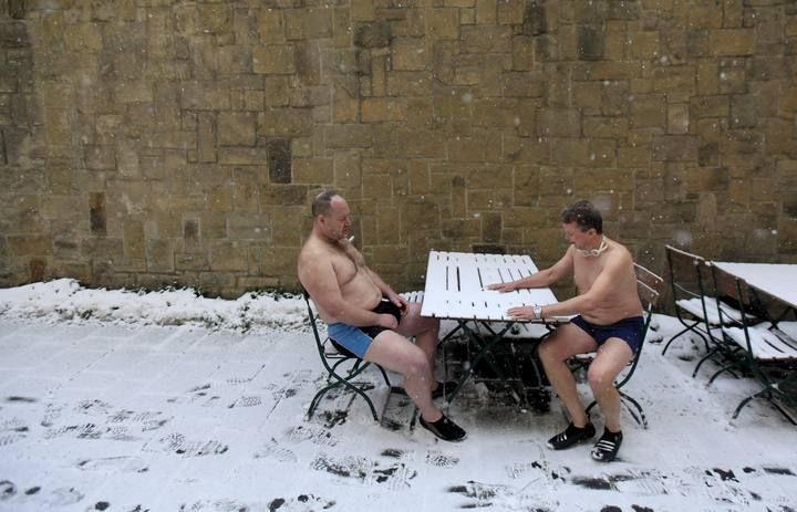 Participants prepare for the traditional Three Kings swim to commemorate Epiphany at the Vltava River in Prague