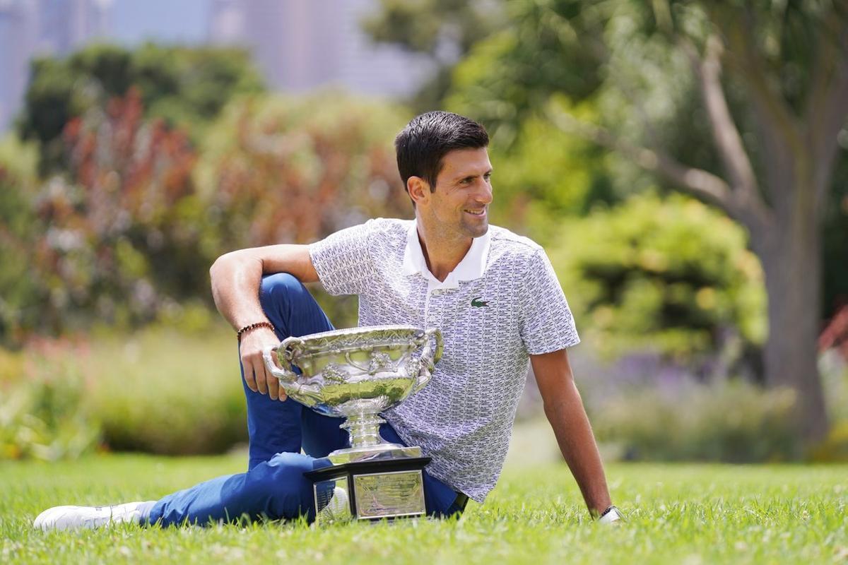 Novak Djokovic of Serbia poses for a portrait at Royal Botanic Gardens Victoria in Melbourne, Monday, February 3, 2020. Novak Djokovic has celebrated his eighth championship title after winning the men’s singles final at the Australian Open tennis tournament. (AAP Image/Michael Dodge) NO ARCHIVING