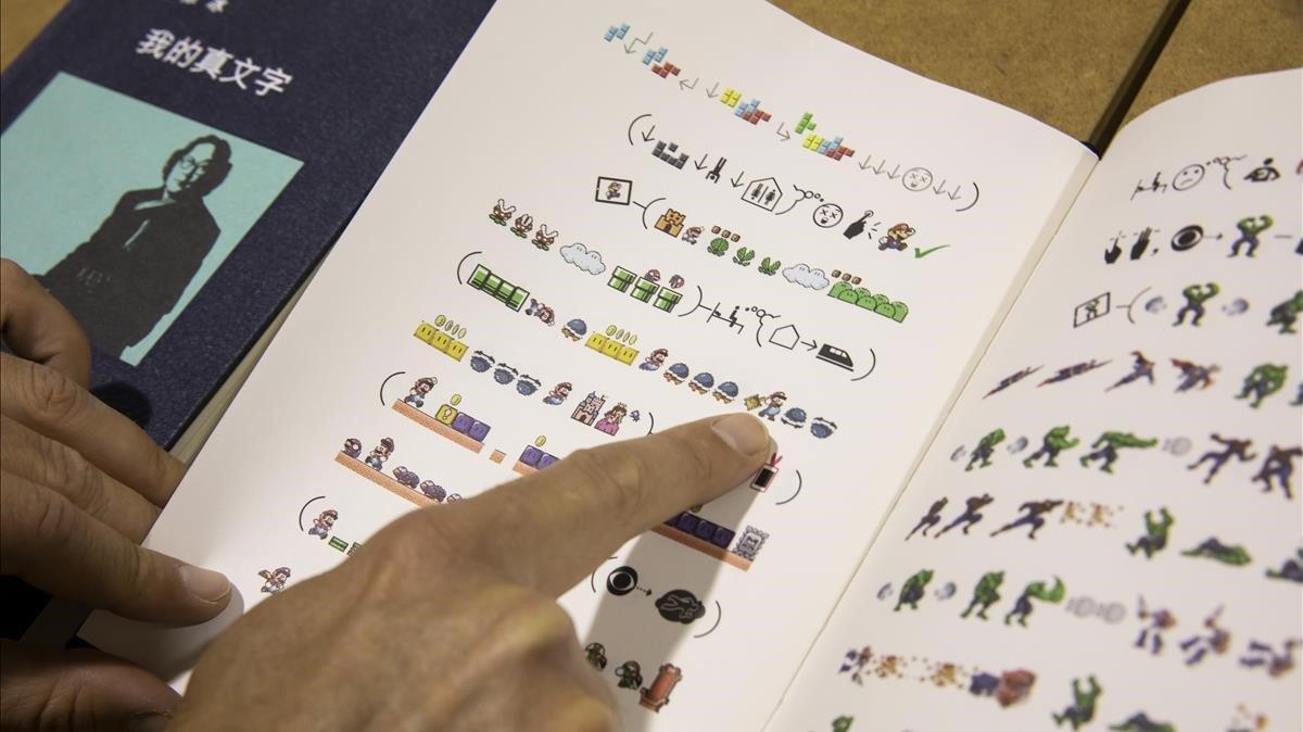 xu bing escribe primer libro en idioma universal de emoticonos