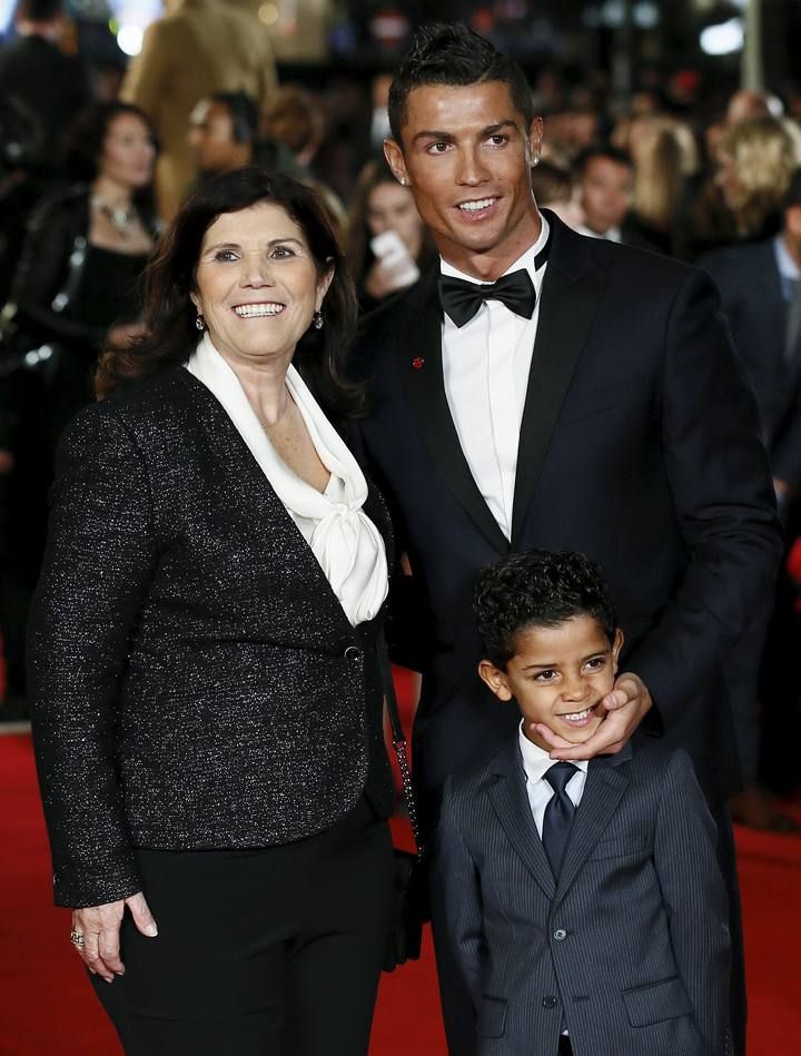 Soccer player Cristiano Ronaldo, his mother Dolores Aveiro and son Cristiano Ronaldo Jr. pose on the red carpet at the world premiere of "Ronaldo" at Leicester Square in London