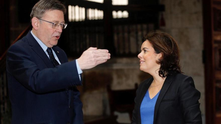 La vicepresidenta Sáenz de Santamaría y el presidente Puig esta mañana en Valencia.