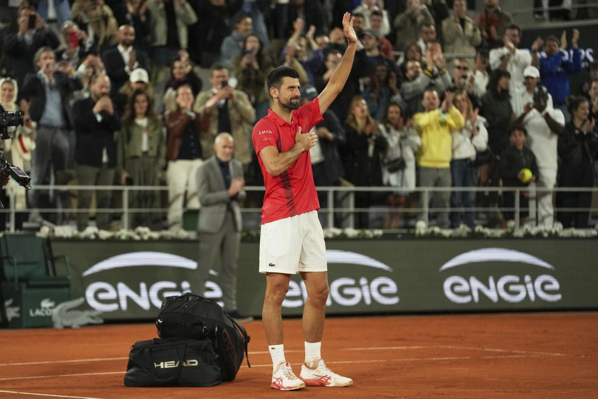 Serbia's Novak Djokovic gestures as he leaves the semifinal match of the French Tennis Open against Italy's Jannik Sinner at the Roland-Garros stadium in Paris, Friday, June 6, 2025. (AP Photo/Thibault Camus)