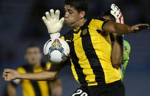 Leyes of Uruguay's Penarol is challenged by Ruiz of Venezuela's Deportivo Anzoategui during their Copa Libertadores soccer match in Montevideo