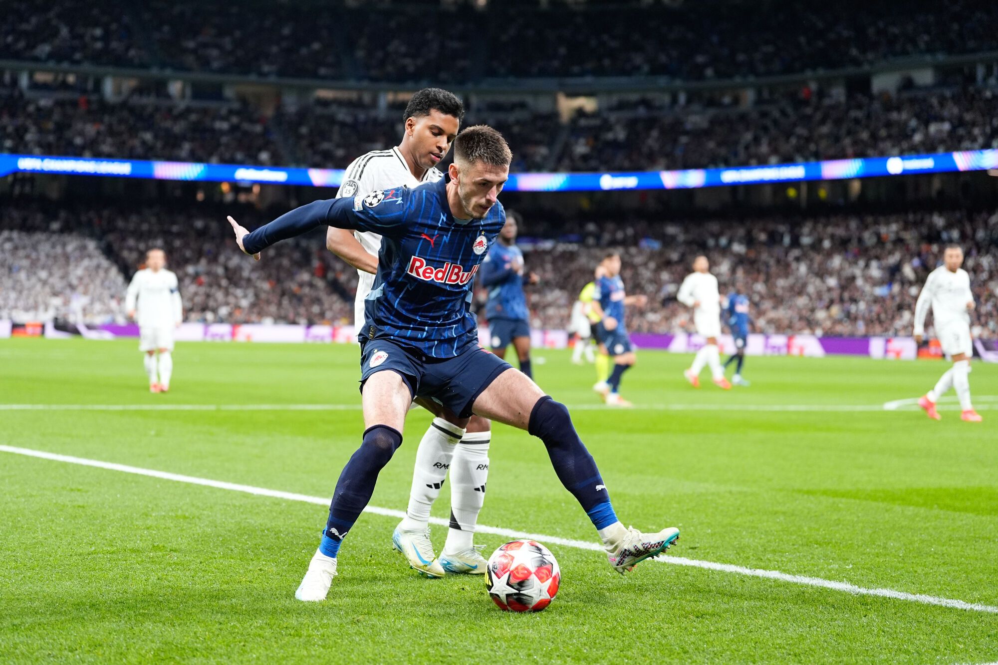 Aleksa Terzic of RB Salzburg and Rodrygo Goes of Real Madrid in action during the UEFA Champions League 2024/25 League Phase MD7 match between Real Madrid and RB Salzburg at Santiago Bernabeu stadium on January 22, 2025, in Madrid, Spain. AFP7 22/01/2025 ONLY FOR USE IN SPAIN. Oscar J. Barroso / AFP7 / Europa Press;2025;SOCCER;SPAIN;SPORT;ZSOCCER;ZSPORT;Real Madrid v RB Salzburg - UEFA Champions League 2024/25 League Phase MD7;