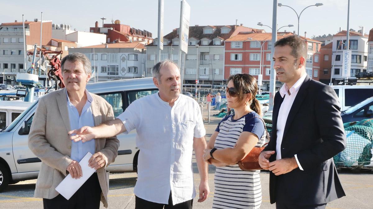 El presidente de Portos el expatrón mayor, la patrona y el conselleiro de Mar.