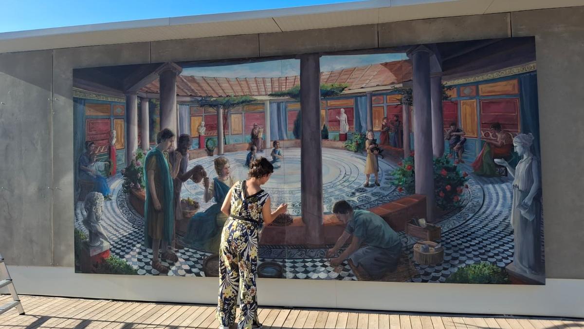 El precioso mural que está en la entrada al yacimiento de Banys de la Reina: riqueza e inteligencia arqueológica