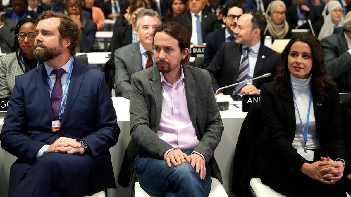 Iván Espinosa de los Monteros (izquierda), Pablo Iglesias e Inés Arrimadas, durante la ceremonia de apertura de la 25ª Conferencia de las Partes del Convenio Marco de Naciones Unidas sobre Cambio Climatico, el 2 de diciembre del 2019